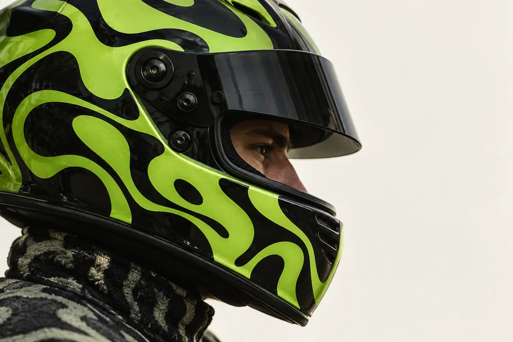 Lime blob-pattern helmet in profile